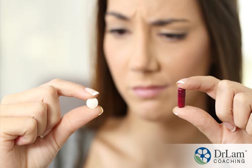 woman trying to choose the right adrenal fatigue supplements