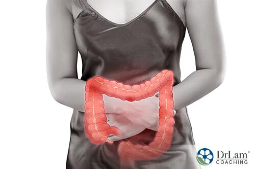  woman holding stomach with diarrhea 