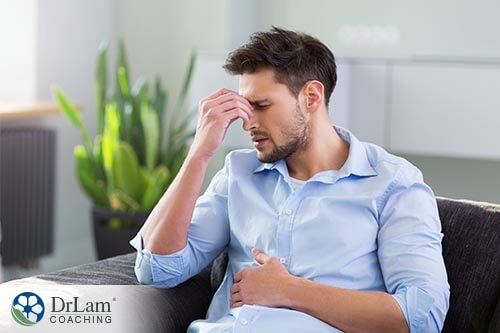 man holding stomach with diarrhea