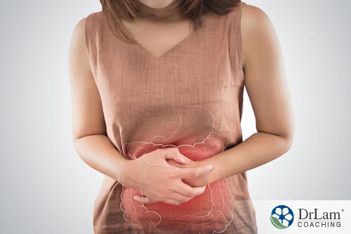 woman with upset stomach that can be aided by kefir