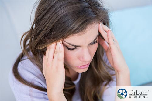 woman with headache not getting enough whole grains