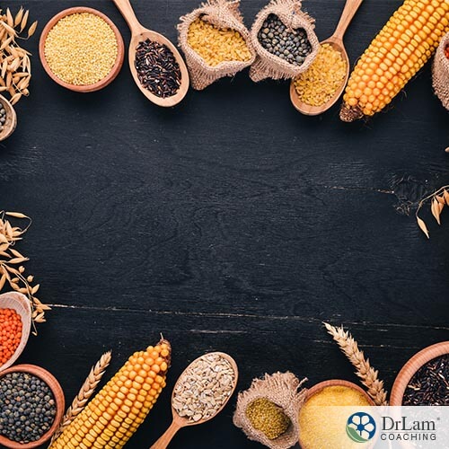 an assortment of whole grains on a black table
