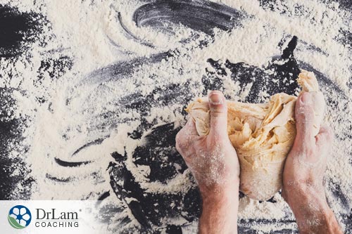 man kneading dough with Gluten Blocking Enzymes