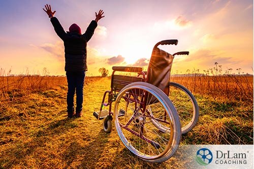 man stepping out of wheel chair and experiencing the health benefits of the sun