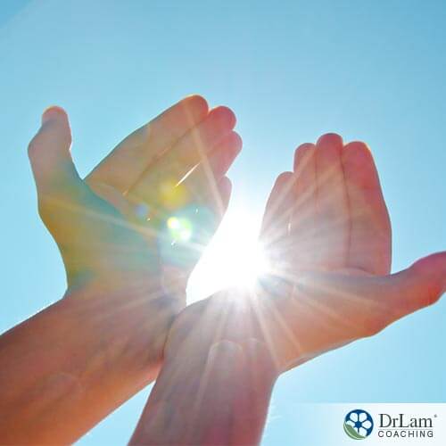 hands receiving the health benefits of the sun
