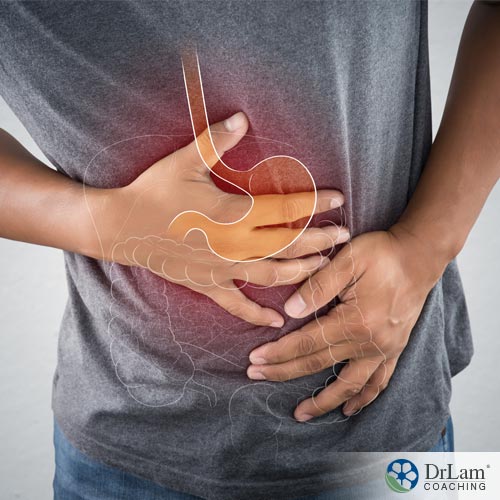 Man holding stomach with Managing IBS