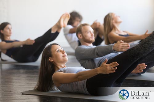 young woman in yoga class benefitting from plant-based diet