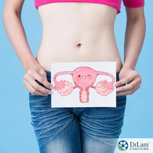 Young women with endometriosis holding picture of uterus