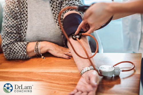 An image of a woman getting her blood pressure checked