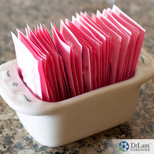 An image of pink artificial sweeteners in a dish