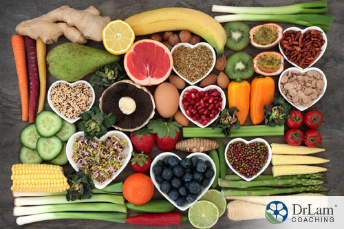 An image of a display of heart-healthy foods on a table with heart-shaped bowls