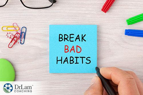 An image of a desktop with a sticknote saying break bad habits