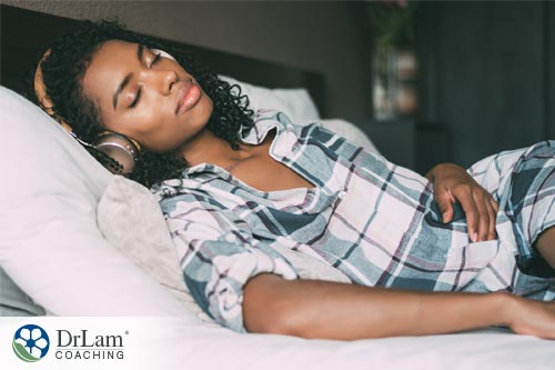 girl in bed using music and opioids to reduce stress