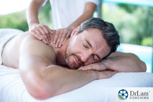  a man getting a massage to help relax his muscles from physical labor