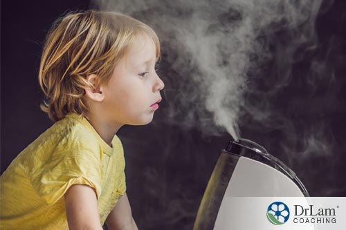 An image of a young child inhaling steam to help with sinus drainage