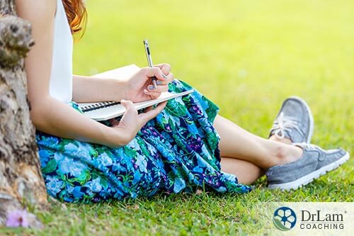 girl using a journal to help with venting therapy