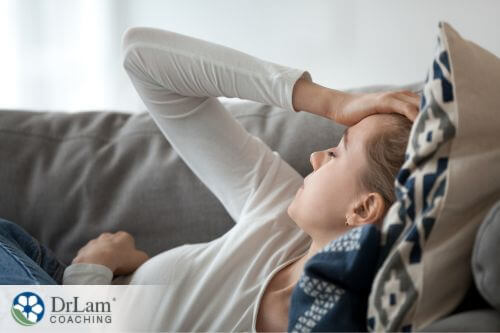 An image of a woman laying on the couch