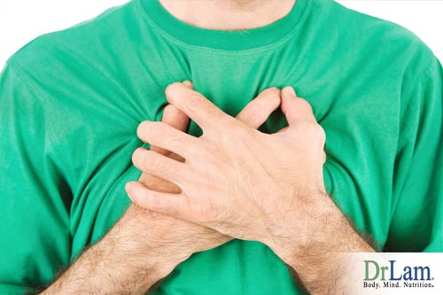 A man suffering from Breathlessness Causes and clutching his chest