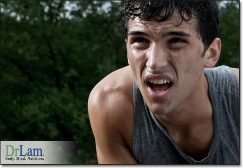 A young man looking tired with perspiration after some exercise outside, representing a body that may tire quickly if subtle Adrenal Fatigue symptoms are not addressed