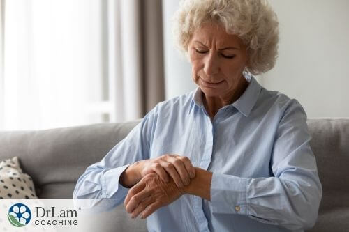 An image of a woman holding her inflammed wrist