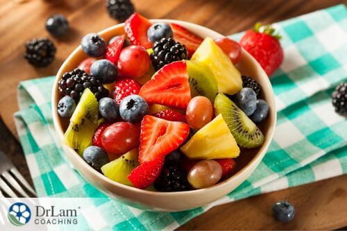An image of a bowl full of sliced fruit