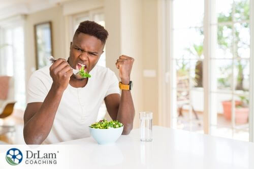 An image of a man eating a salad