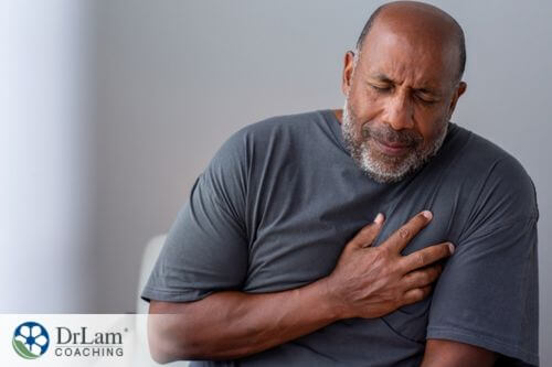An image of a man holding his chest in pain