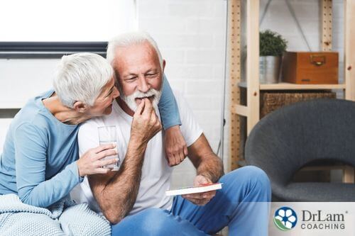 An image of an older couple taking supplements