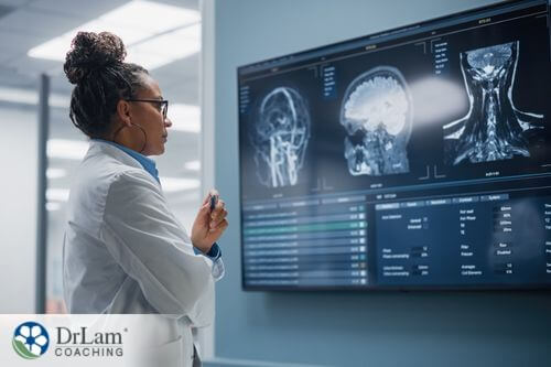 An image of a doctor checking several scan images