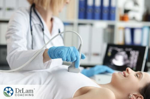 An image of a woman having a breast ultrasound done