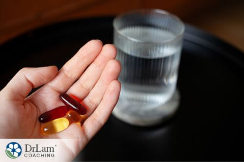 An image of someone holding supplements