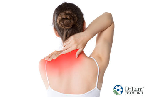 An image of a woman experiencing neck and shoulder pain