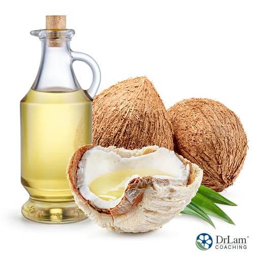 An image of coconuts and a bottle of coconut oil