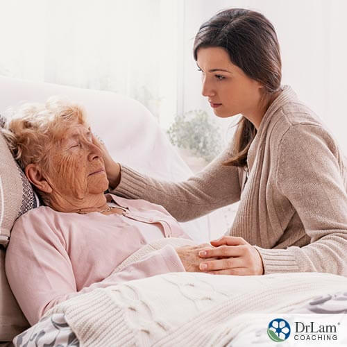 Image of a caregiver taking care of a elderly lady