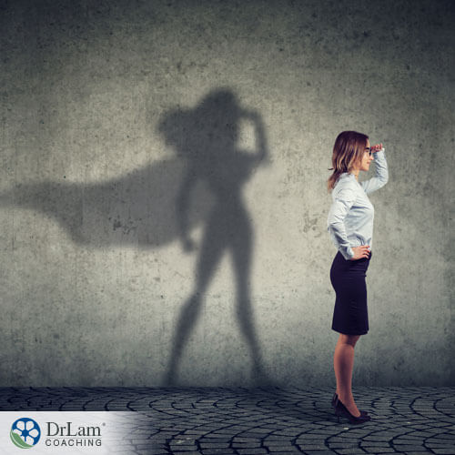 An image of a woman with a superwoman shadow