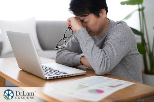 An image of a stressed man at his laptop
