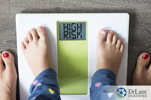 An image of a child't feet on a scale that says high risk