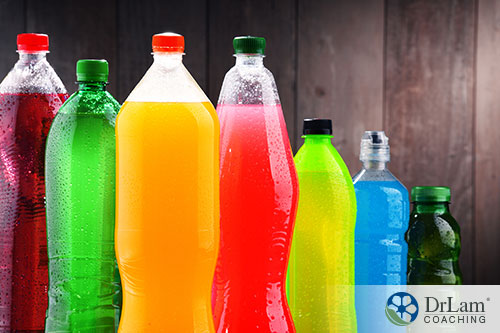 An image of plastic bottles holding different colored drinks