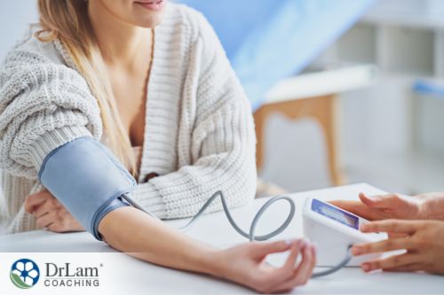 An image of a woman having her blood pressure measured