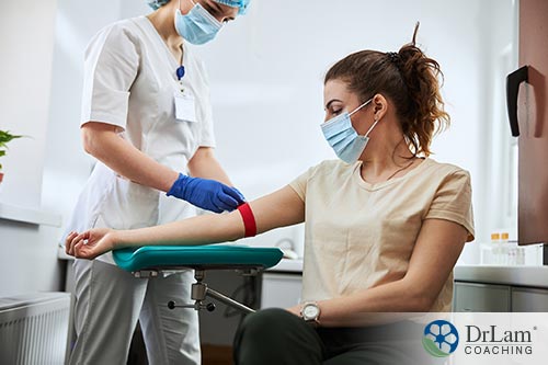 An image of a woman having blood drawn