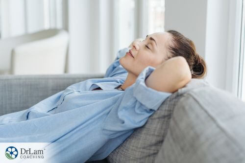 An image of a woman resting on the couch