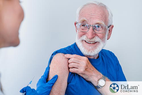 An image of an old man getting the Covid vaccine