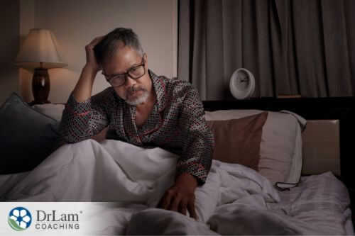 An image of an older man in bed
