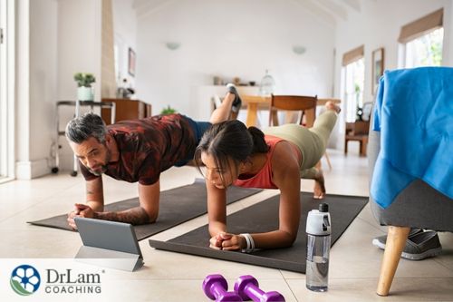 An image of a man and woman exercising