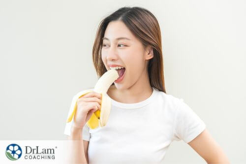 An image of a woman eating banana