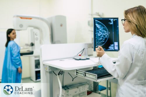 An image of a woman having a mamogram done