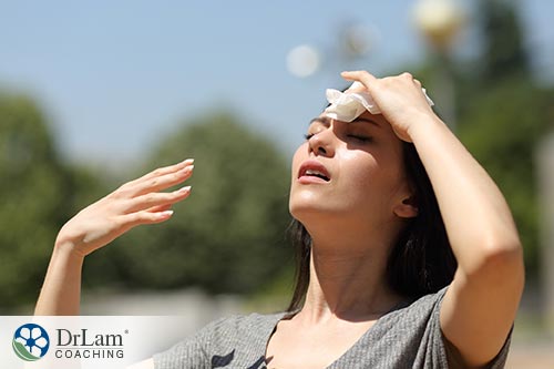 An image of a sweating woman in the sun