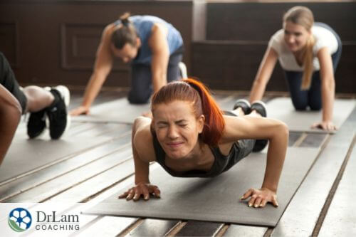 An image of a young woman struggling to exercise
