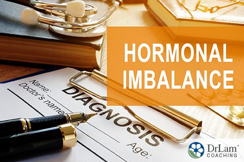 An image of a doctor's clipboard with a diagnosis form and pens with the words hormonal imbalance above it in an orange box