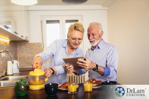 An image of a couple happily making juice and managing their symptoms of functional dyspepsia together